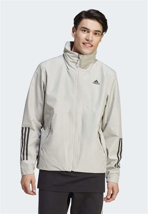 adidas Sportswear Regenjacke / wasserabweisende Jacke